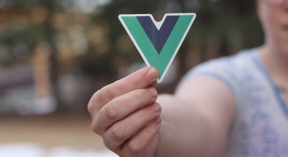 Person Holding Vuejs logo